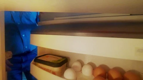 Taked two eggs from the fridge. Stock Footage 107987928