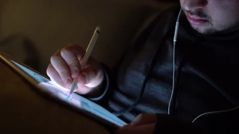 Taken in close up, illustrator is drawing on the tablet Stock Footage 143843053