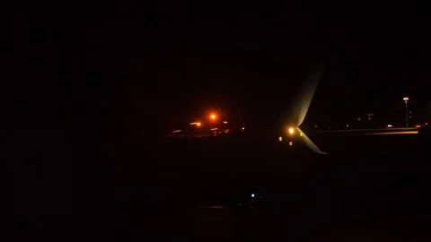 Takeoff airplane aircraft flight concept. the plane taking off at night at the Stock Footage