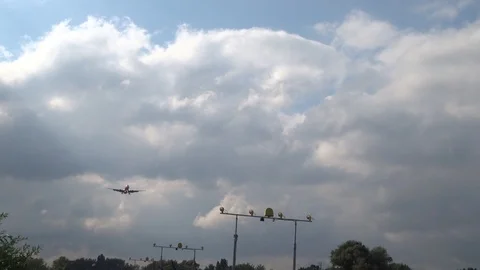 Takeoff airplane on a cloudy sky background Stock Footage 116495161