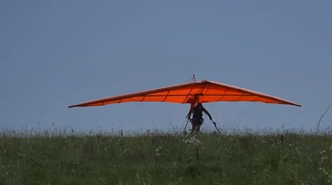 Takeoff of a hangglider in slow motion Stock Footage 64596707