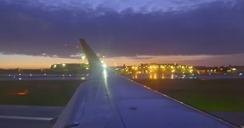 Takeoff moment from the window of a plane and city lights seen from the sky. Stock Footage 260819672