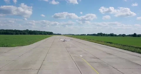 Takeoff of an old plane, down the runway, beautiful summer landscape, sun green Video stock 138035319