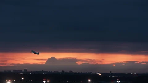 Takeoff on a red sky background Stock Footage 116717576