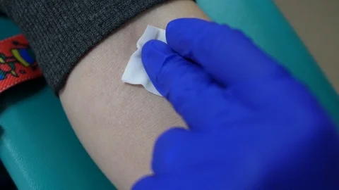Takes a blood sample for tests Stock Footage 102778260
