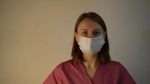 Takes off mask Video stock 126106018