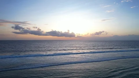 Taking off aerial view of drone shot flying above deep water ocean surface at Stock Footage 256152366