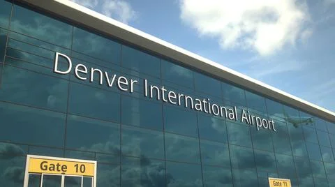 Taking off airplane reflecting in the modern windows with Denver International Ilustración de archivo