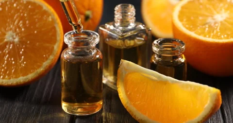 Taking and dripping aromatic essential oil from pipette into perfume Stock-Footage 306316631