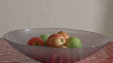 Taking apple from a fruit bowl Stock Footage 86685697