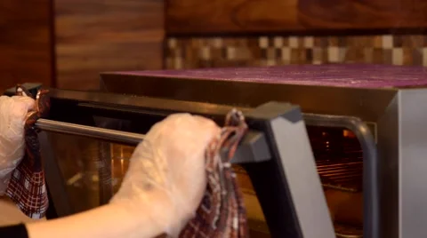 Taking a baked baguette from oven Vídeos de archivo 59579268