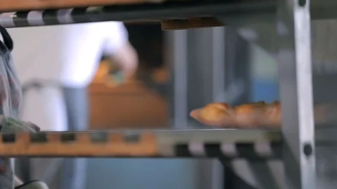 Taking A Baked Baguettes From Oven Stock Footage 89575965