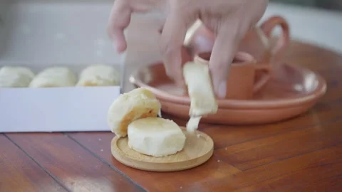 Taking a baked cake on a bamboo plate to eat Stock Footage 283548539