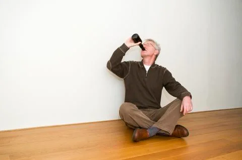Taking A Beer In An Empty Room Stock Photos