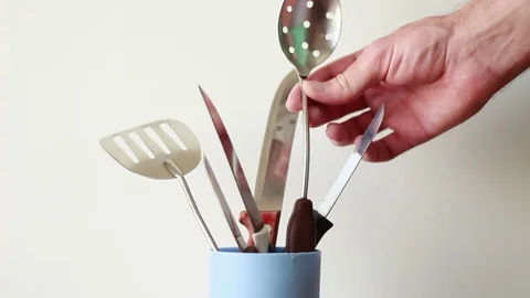 Taking big spoon from a plastic can Stock Footage 76996134