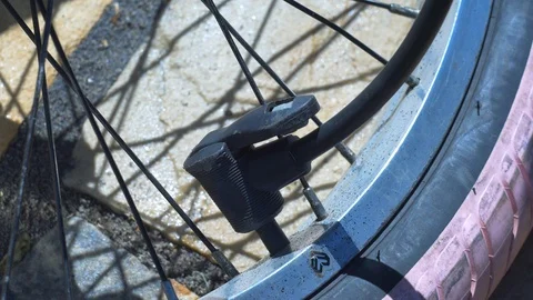 Taking off bike pump Stock Footage 94629739