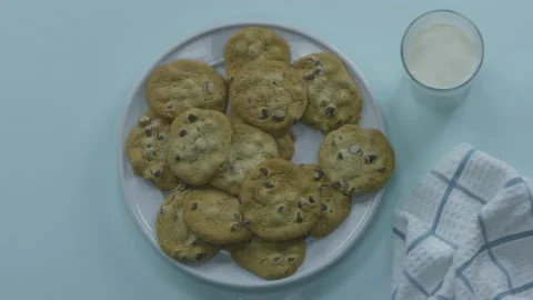 Taking a Bite of a Cookie with Milk Stock Footage 208753367