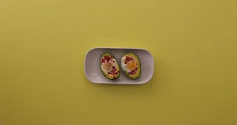 Taking a bite out of the avocado, eggs, and bacon 1 Video stock 132149626