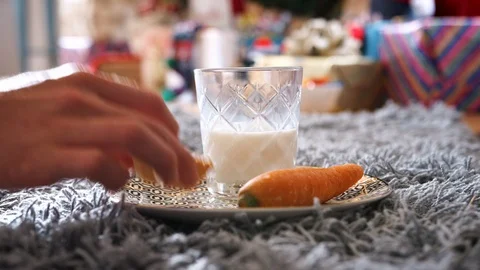 Taking Bite Out Of Mince Pie With Carrot And Glass Of Milk Left Out For Santa On 스톡 동영상 99769584