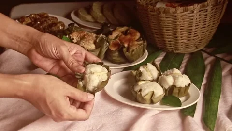 Taking a bite out of a puto or Filipino steamed rice cake 스톡 동영상 249725060