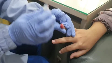 Taking Blood Sample Process from Kids Hand that Suffer Disease in Hospital Stock Footage 219031658