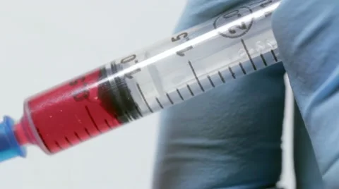 Taking blood into syringe Video stock 18563173
