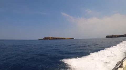 Taking boat trip look out to Xiyupingyu from a distance to ocean sea scape horiz Stock Footage 243000802