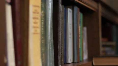 Taking books from bookshelf Vídeo Stock 64066203