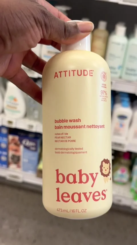Taking a bottle of Baby Leaves bubble wash from a store shelf Stock Footage 334963000
