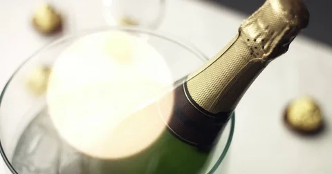 Taking a bottle of sparkling wine from ice Stock Footage 81917042