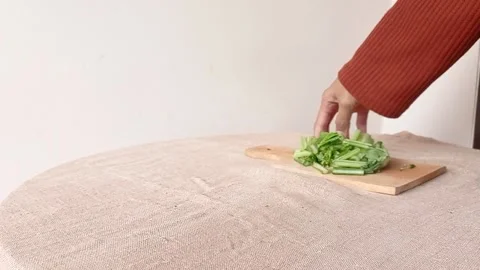 Taking the bowl of green vegetable for making a dish in the kitchen Stock Footage 149709429