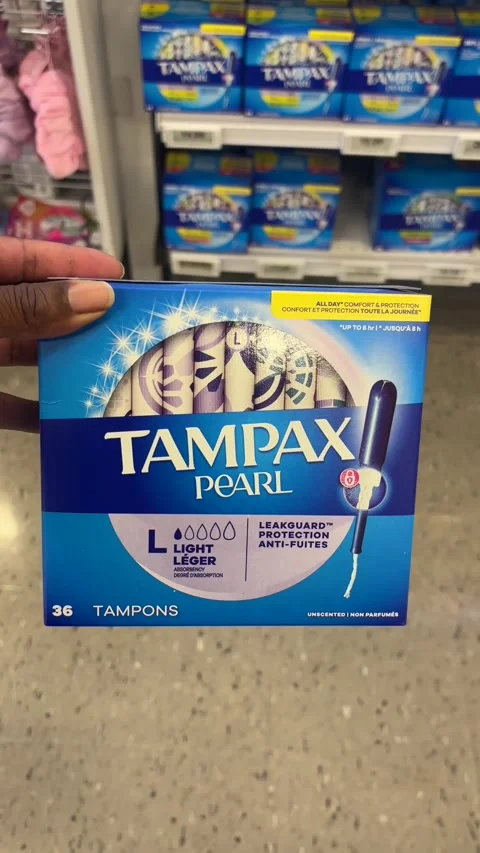 Taking a box of Tampax Pearl light tampons from a store shelf Stock Footage 334580493