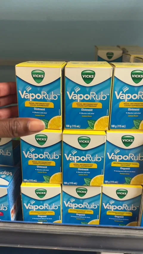 Taking a box of VapoRub from a store shelf Stock Footage 334580434