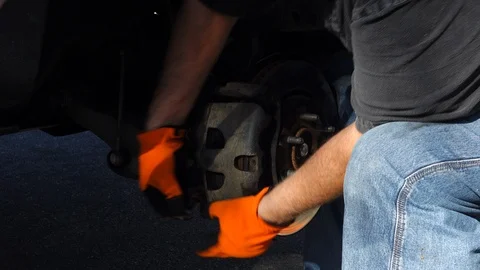 Taking off brake caliper Stock Footage 121600051