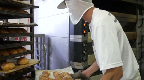 Taking Bread Out Of The Oven Stock Footage 51343838