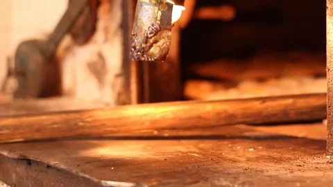 Taking bread out of the oven 스톡 동영상 130084392