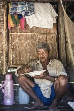 Taking a break for lunch in paddy fields (rice paddies) at Sungai Pinang, a Stock Photos