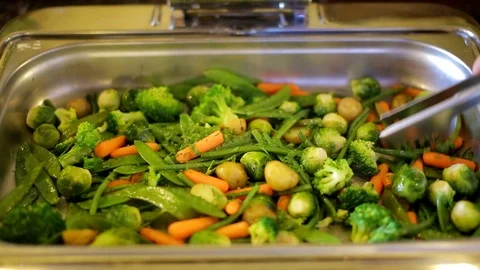 Taking Broccoli From A Bowl Of Cooked Vegetables 動画素材 95696291