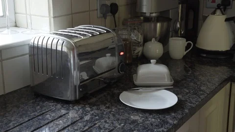 Taking brown bread out of toaster and spreading big slab of butter Stock Footage 111711830