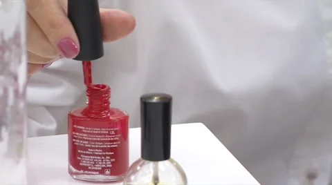 Taking A Brush From The Bottle Of Red Nail Polish Stock Footage 63496956