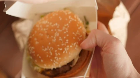 Taking burger from a paper bag, top view Stock Footage 126027166
