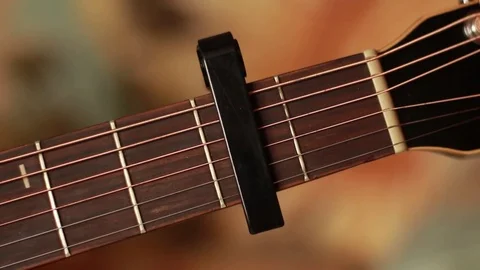 Taking off a capo from a guitar's neck 動画素材 71953914