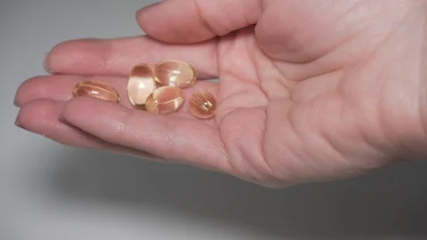 Taking capsules from the jar Stock Footage 101587244