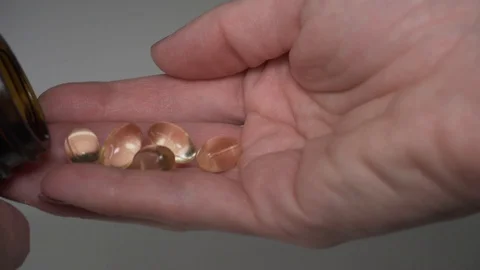 Taking capsules from the jar Stock Footage 101587359
