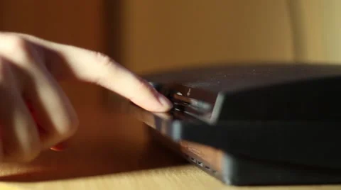 Taking off the CD from game console Stock Footage 57019735