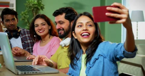 Taking cheerful selfie, college students study complete assignment using laptop Vídeo Stock 342383516
