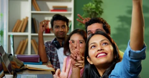 Taking cheerful selfie, college students study complete assignment using laptop Vídeo Stock 342383543