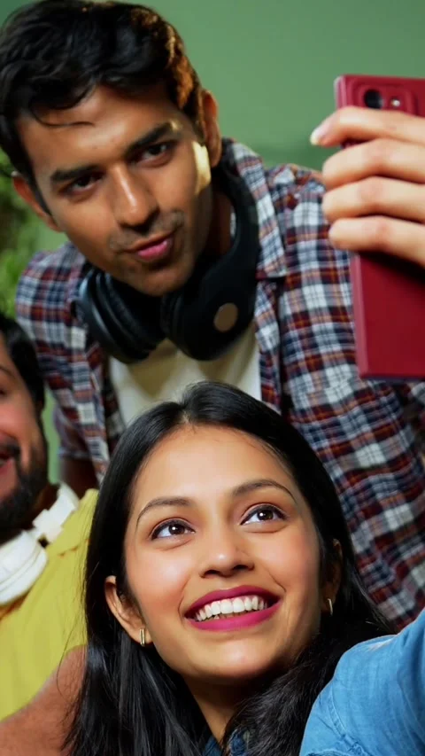Taking cheerful selfie, college students study complete assignment using laptop Stock Footage 342385050