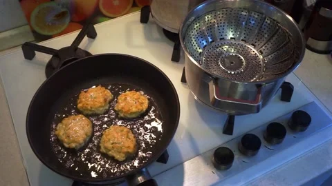 Taking chicken homemade cutlets from a pan and putting meat in a pot 스톡 동영상 196996792