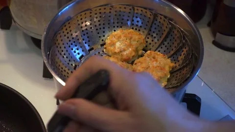Taking chicken homemade cutlets from a pan and putting meat in a pot 스톡 동영상 196996840